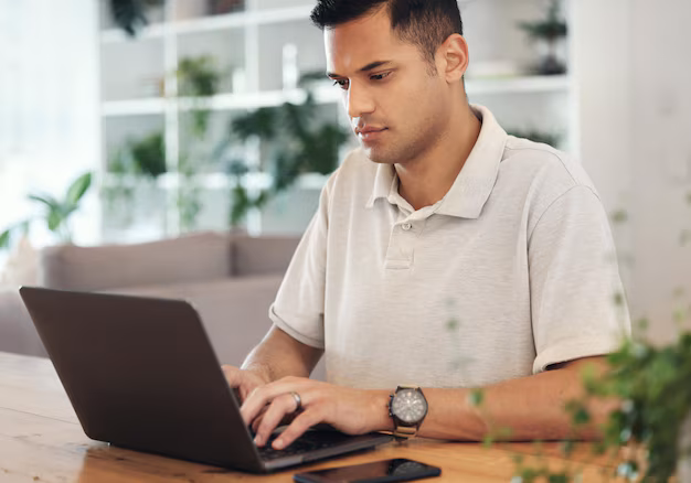 Young person using laptop for financial planning